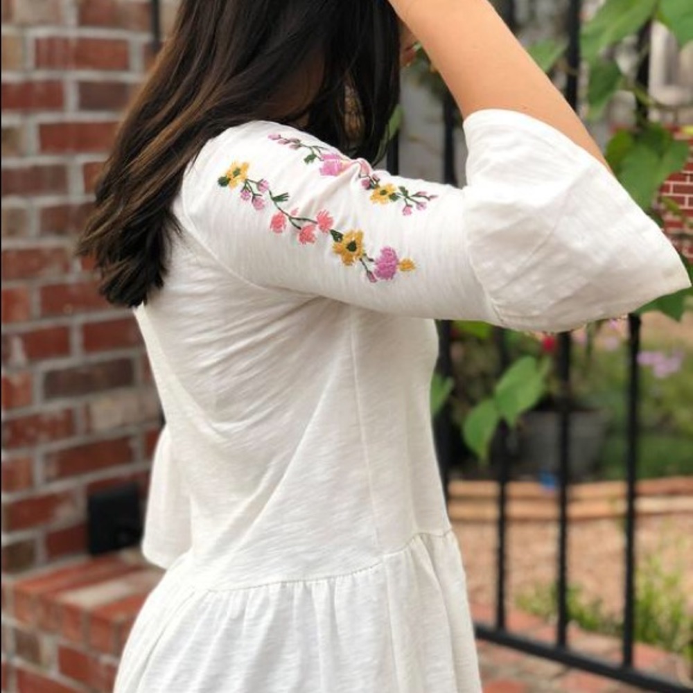 Embroidered sleeve peplum top